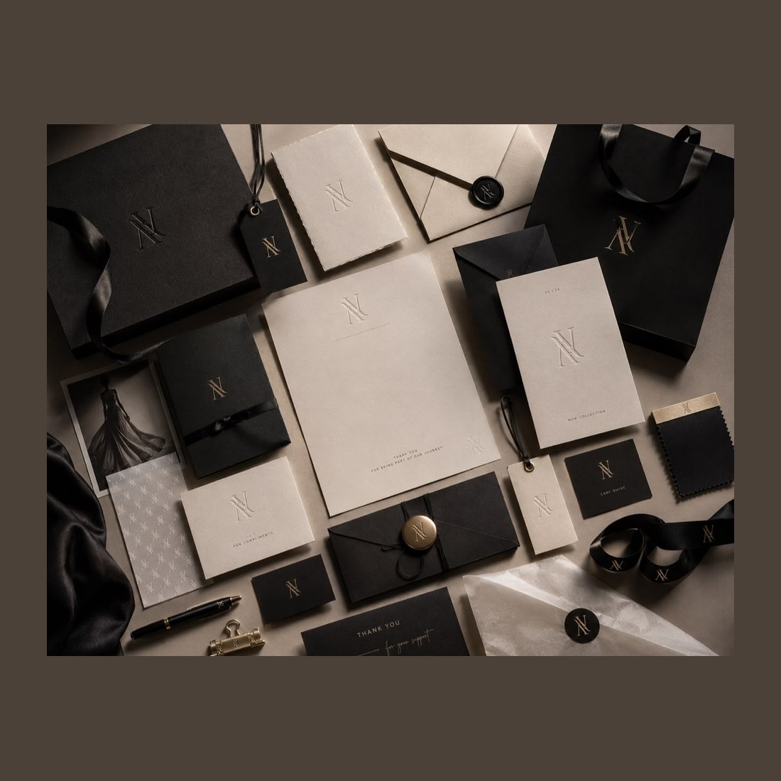 One monogram across a whole range of bags, boxes and ribbon, in cream and gold