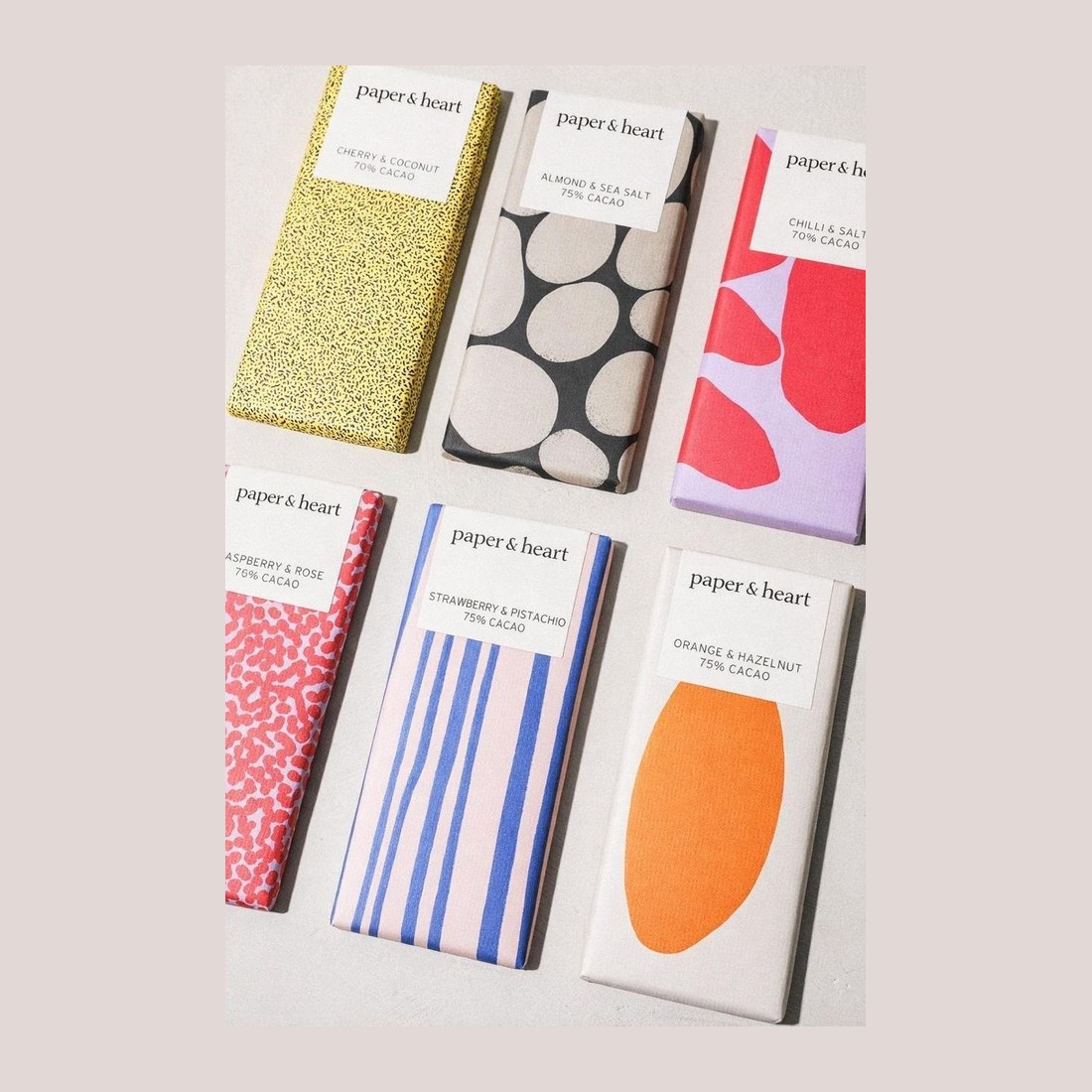 Six chocolate bars, each wrapped in a different printed pattern